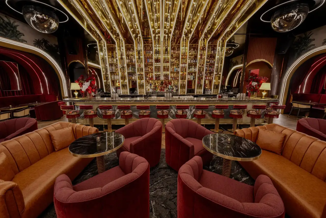 The marble-topped bar with gold shelving