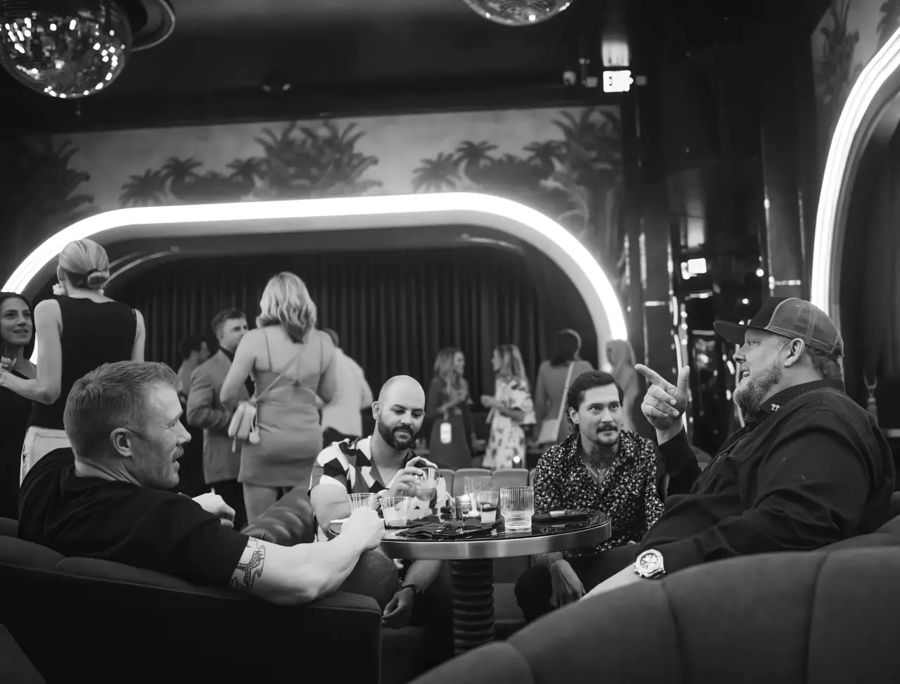 A full lounge on a music night, in black and white